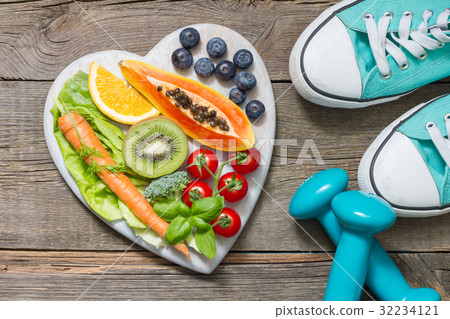 Healthy diet and sport concept with dumbbells Healthy diet and sport concept with dumbbells 32234121