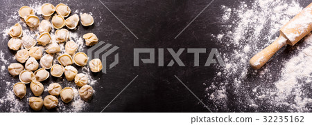 fresh raw russian pelmeni, ravioli or dumplings 32235162