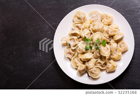 Plate of russian pelmeni, ravioli or dumplings 32235168