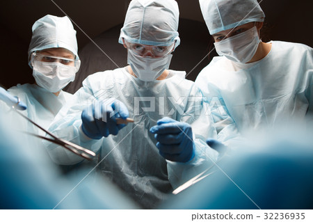 Photo of surgeons with instruments Photo of surgeons with instruments 32236935