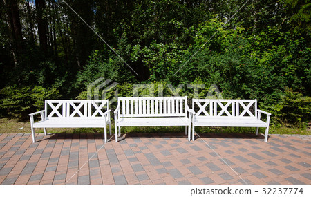 White Wooden Benches in the park, summer day 32237774