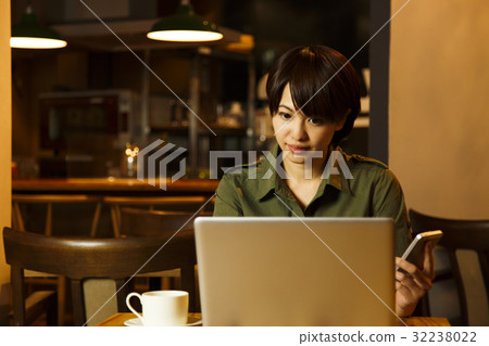Cafe female smartphone personal computer young woman cafeteria at night leaving after 5 after-sale Cafe female smartphone personal computer young woman cafeteria at night leaving after 5 after-sale 32238022