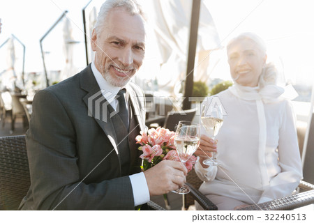 Portrait of elegant man that smiling enigmatically 32240513