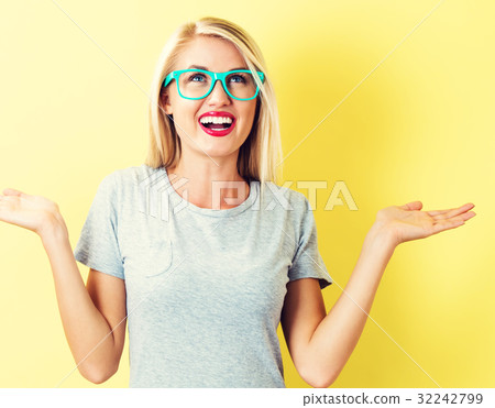 Woman reaching and looking upwards Woman reaching and looking upwards 32242799