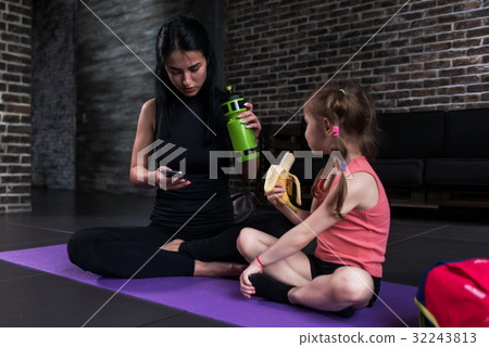 Yoga kid instructor and a girl having a break Yoga kid instructor and a girl having a break 32243813