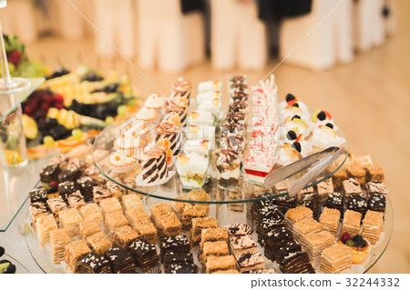 Delicious sweets on wedding candy buffet with Delicious sweets on wedding candy buffet with 32244332