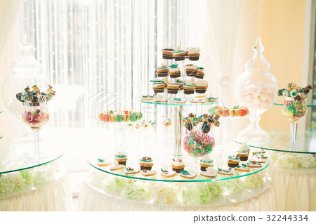 Different kinds of baked sweets on a buffet Different kinds of baked sweets on a buffet 32244334
