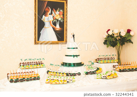 Delicious sweets on wedding candy buffet with Delicious sweets on wedding candy buffet with 32244341