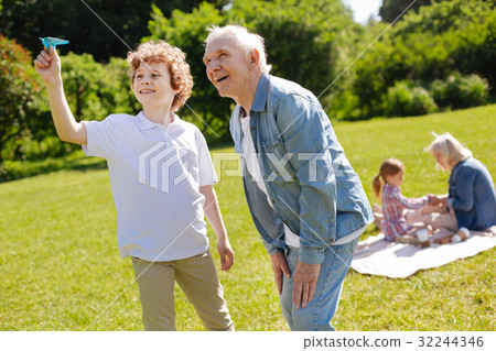 Positive teenager being glad while playing with 32244346