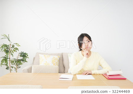A young woman studying at home A young woman studying at home 32244469