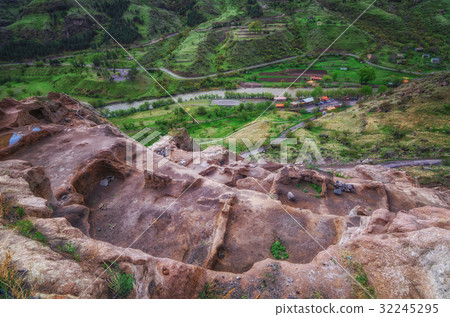 Tourists visiting Vardzia ancient cave city on a 32245295