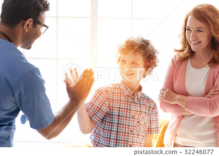 Handsome teenager giving high-five to his friend 32246077