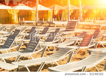 Beach sun loungers stand on the sand, relax. 32246102