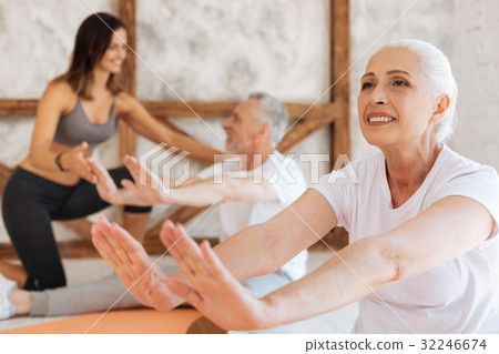 Positive delighted retirement stretching her body 32246674