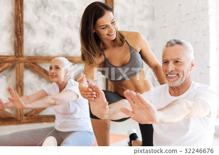 Beautiful fitness coach looking at her visitor 32246676