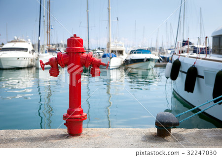 Marine fire hydrant on the quay in front of the 32247030