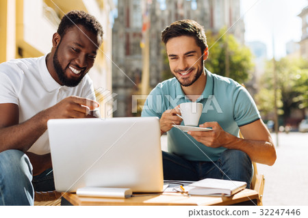 Two enthusiastic guys spending their time together Two enthusiastic guys spending their time together 32247446