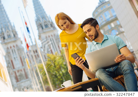 Intelligent enthusiastic man asking his friend Intelligent enthusiastic man asking his friend 32247847