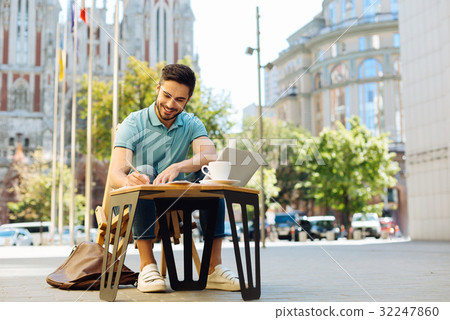 Smart enterprising guy working outdoors 32247860