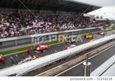 Racing cars on the starting grid. The focus on the Racing cars on the starting grid. The focus on the 32248216