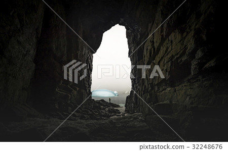 The man stands at the end of the cave. Andreev. 32248676