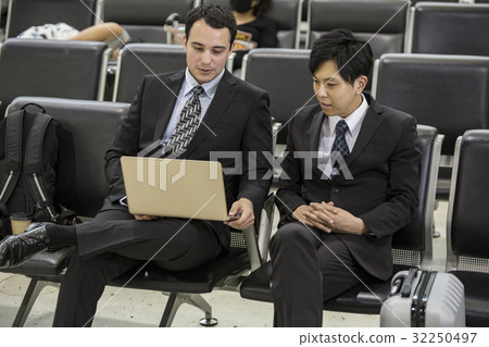 Businessmen waiting for boarding Businessmen waiting for boarding 32250497