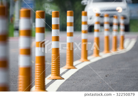 Flexible traffic bollard for bike lane. Flexible traffic bollard for bike lane. 32250879