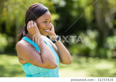 Happy woman listening music Happy woman listening music 32253428