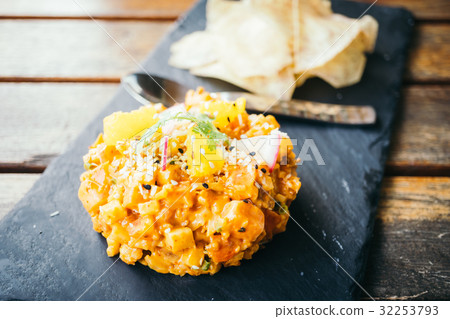 Raw fresh salmon meat tartare in black plate 32253793