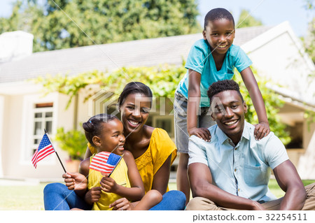 Happy family showing usa flag Happy family showing usa flag 32254511