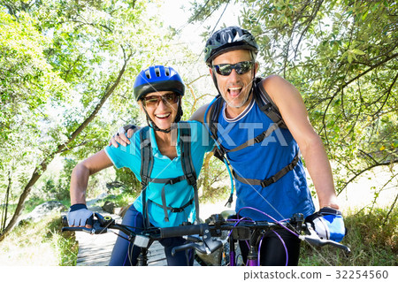 Senior couple standing with their bikes 32254560