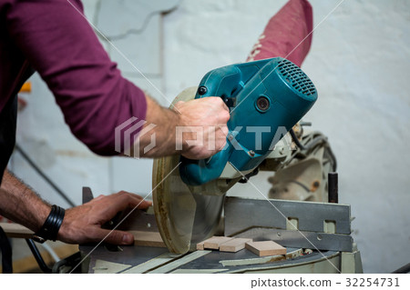 Carpenter working on his craft 32254731