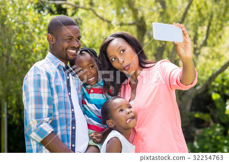 Happy family taking picture 32254763