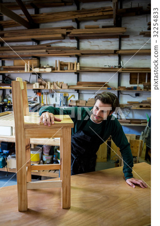 Carpenter working on his craft 32254833