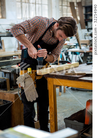 Carpenter working on his craft Carpenter working on his craft 32254940