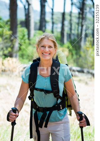 senior woman standing with their stick senior woman standing with their stick 32255239