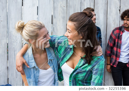 Women embracing each other Women embracing each other 32255396