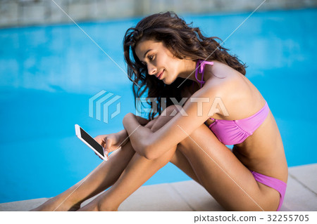Beautiful woman using mobile phone 32255705