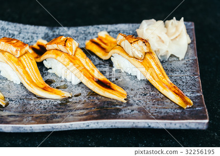 Grilled eel fish sushi with foie gras on top Grilled eel fish sushi with foie gras on top 32256195