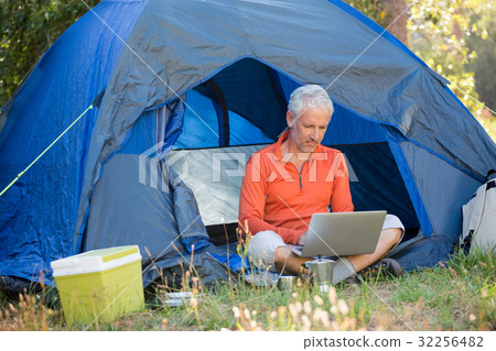 Mature man using computer Mature man using computer 32256482
