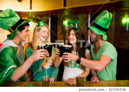 Smiling friends with Irish accessory 32256536