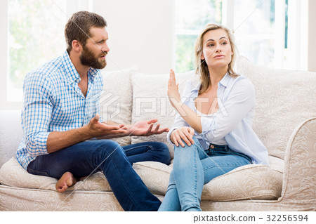 Upset couple arguing with each other Upset couple arguing with each other 32256594