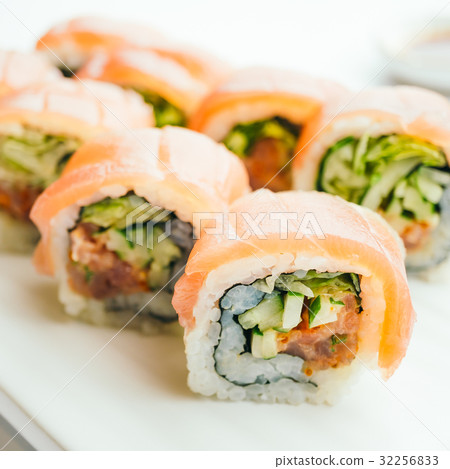 Raw fresh sushi roll with wasabi in white plate 32256833