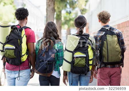 Friends standing with rucksack Friends standing with rucksack 32256939