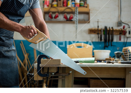 Carpenter working on his craft Carpenter working on his craft 32257539