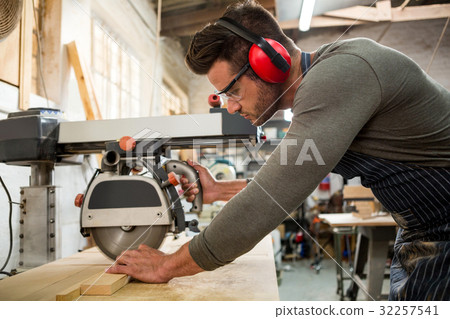 Carpenter working on his craft 32257541