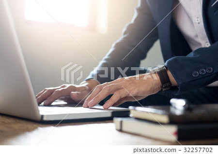 Close up of Young Businessman Working typing On Laptop In Coffee Close up of Young Businessman Working typing On Laptop In Coffee 32257702