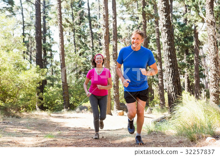 Couple smiling and running Couple smiling and running 32257837
