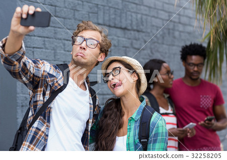 Couple taking selfie on a mobile phone 32258205