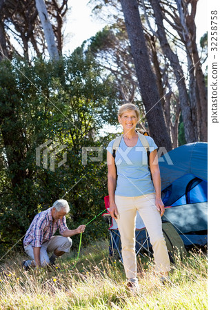 Mature couple preparing hike Mature couple preparing hike 32258758